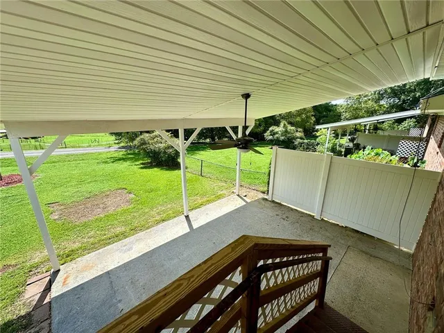a view of a backyard with sitting area