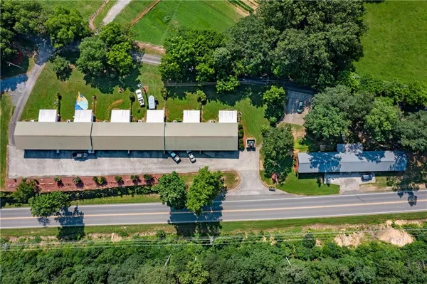 a view of a garden with chairs