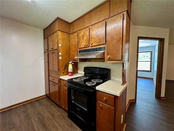 a kitchen with stainless steel appliances granite countertop a stove and a refrigerator