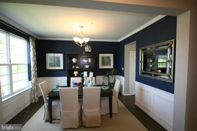 a view of a dining room with furniture and window