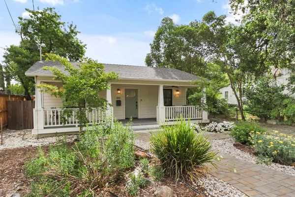 a front view of a house with garden