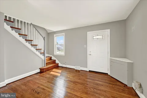 a view of entryway with wooden floor