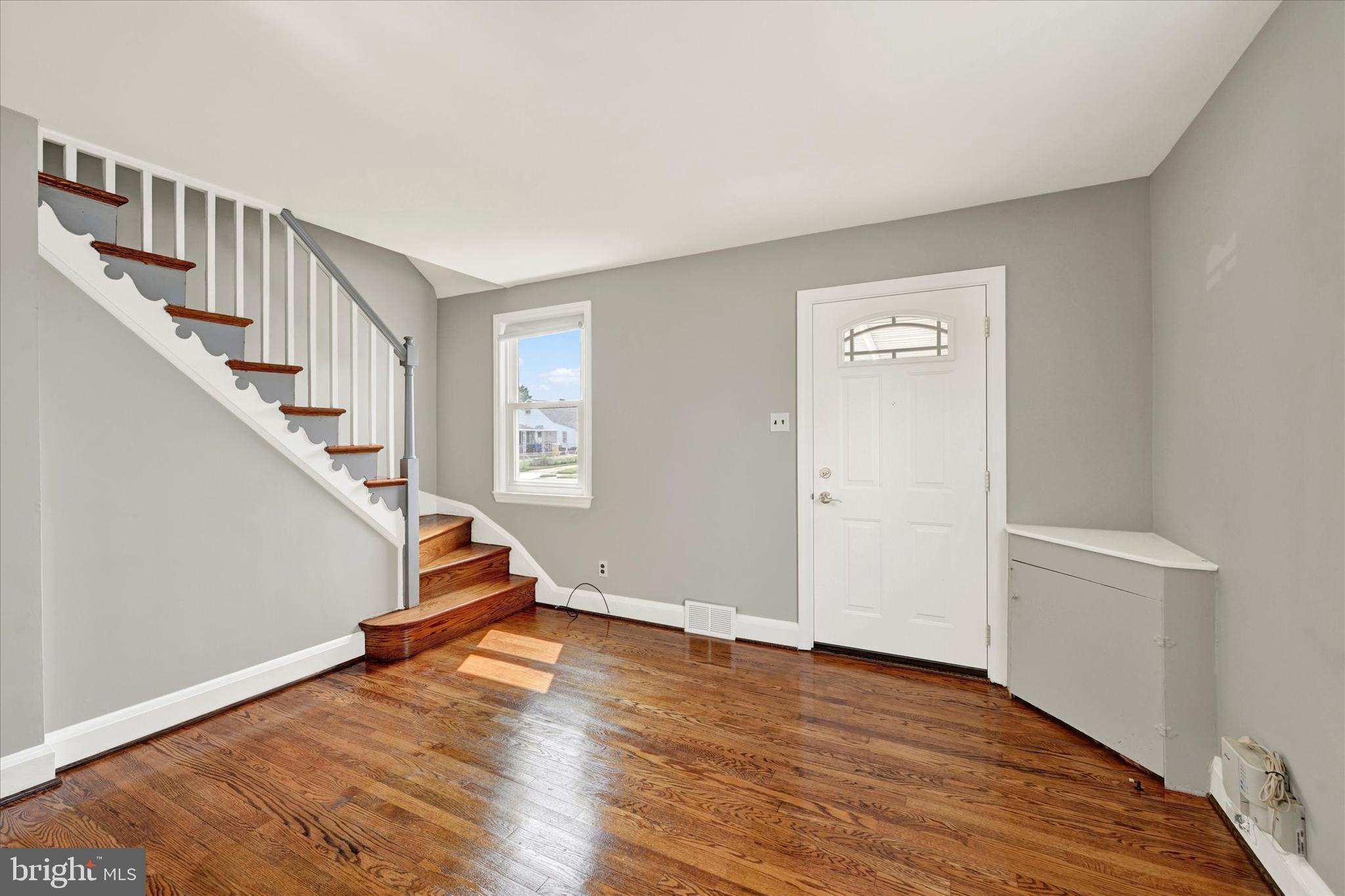 6820 Bessemer Avenue Baltimore, MD 21222 - Photo 6 of 17 a view of entryway with wooden floor
