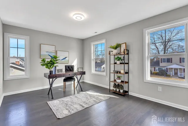 a view of a workspace with furniture and a potted plant