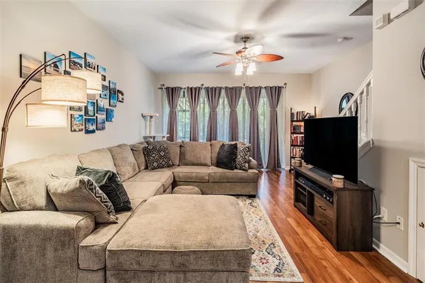 a living room with furniture and a flat screen tv