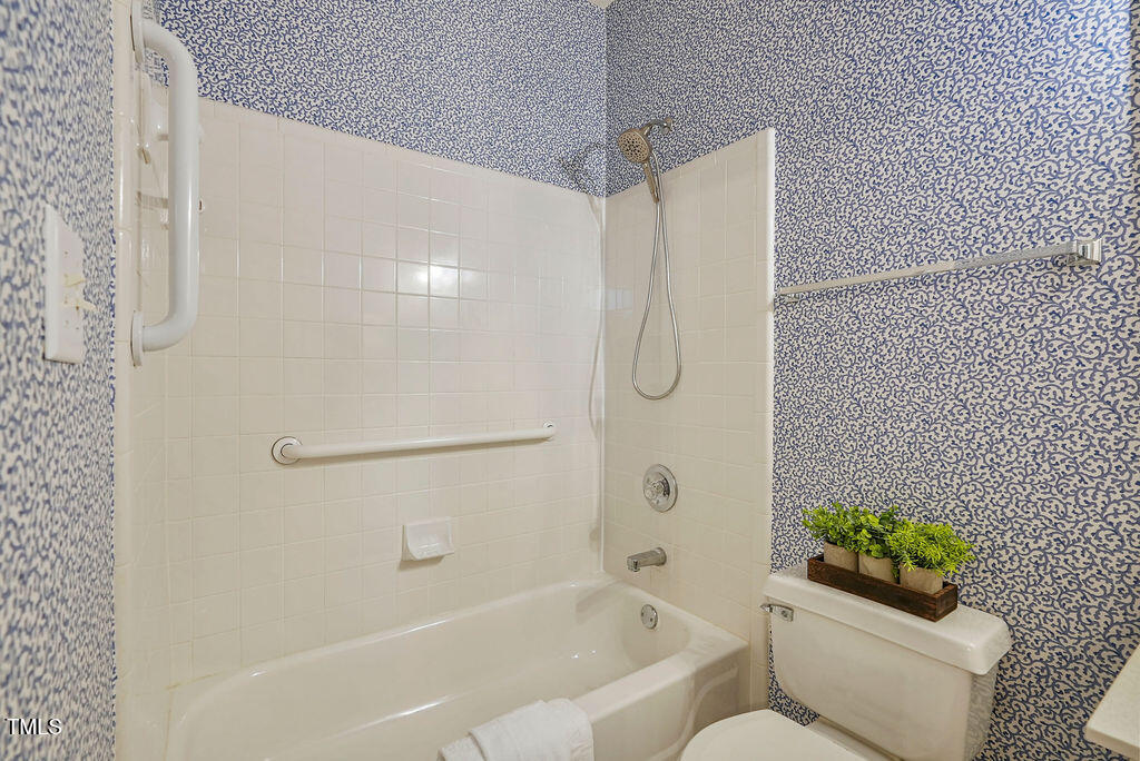125 Chimney Rise Drive Cary, NC 27511 - Photo 31 of 41 a bathroom with a shower a toilet and a shower