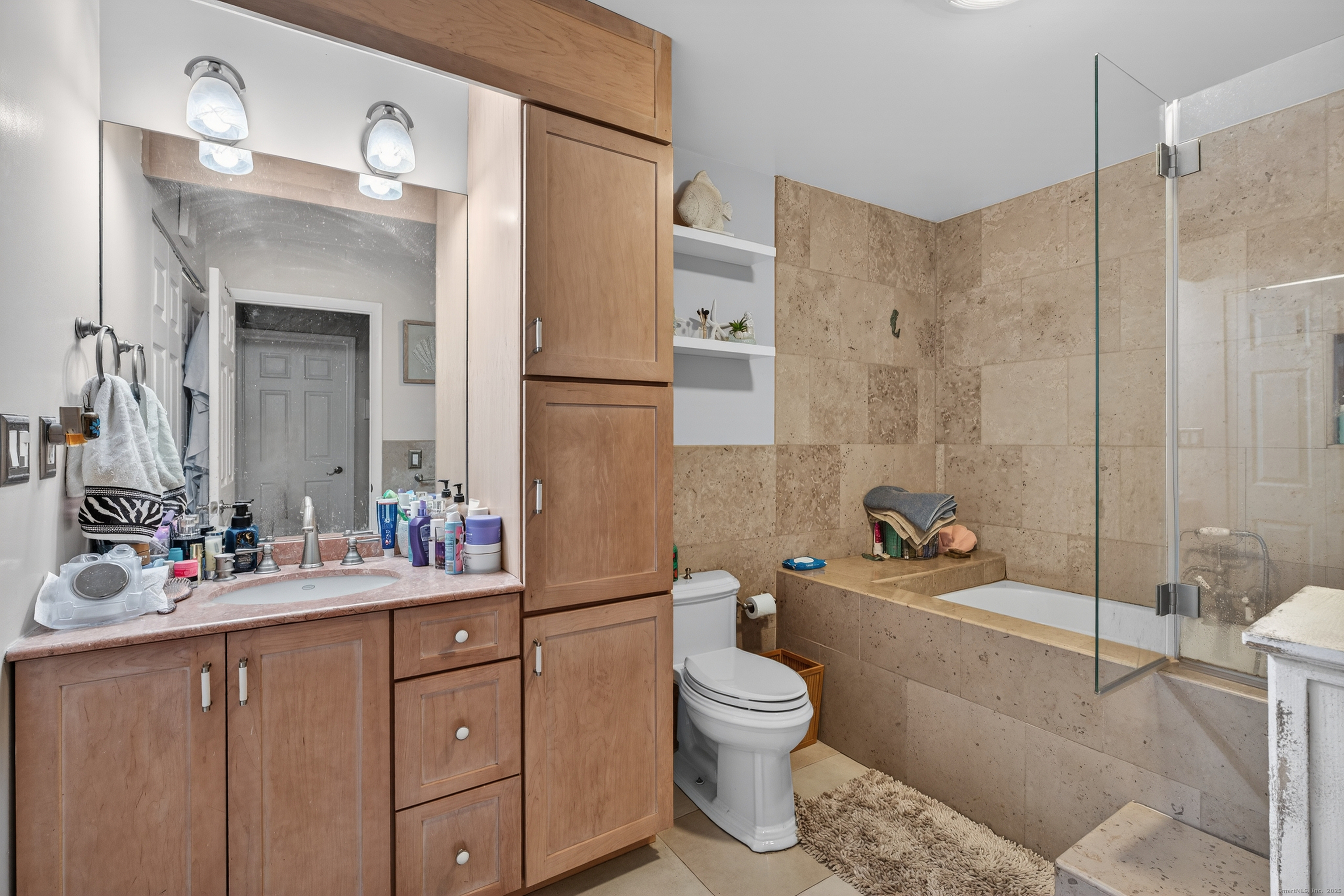 142 W Walk, Unit 142 West Haven, CT 06516 - Photo 16 of 22 a bathroom with a sink toilet tub and shower