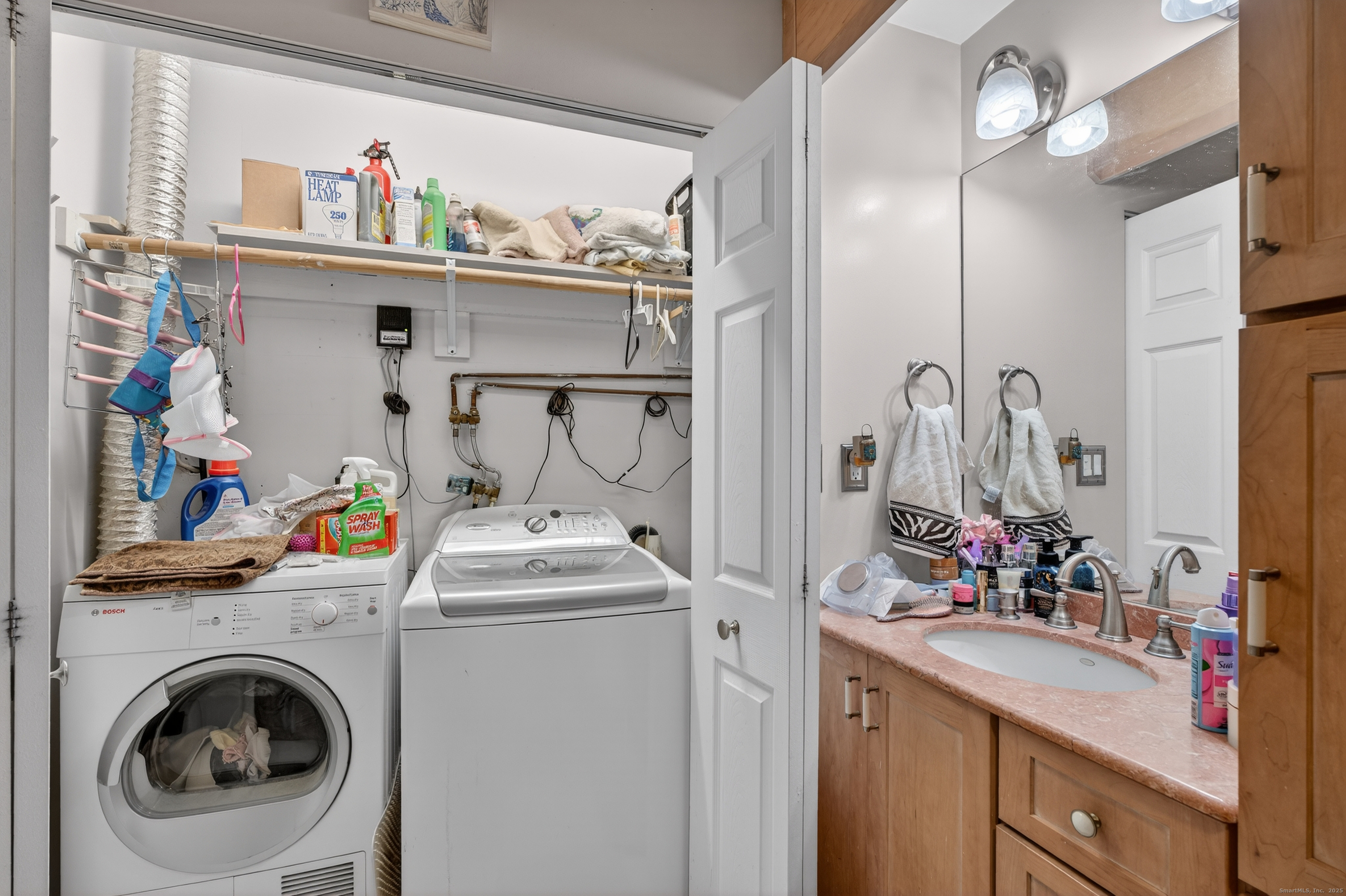 142 W Walk, Unit 142 West Haven, CT 06516 - Photo 17 of 22 a storage room with washer and dryer