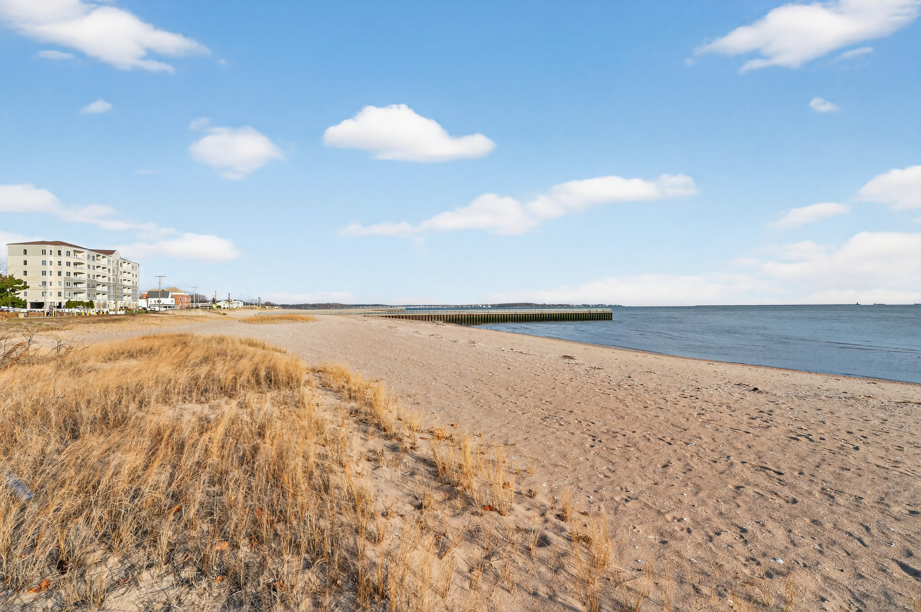 142 W Walk, Unit 142 West Haven, CT 06516 - Photo 19 of 22 a view of an ocean and beach