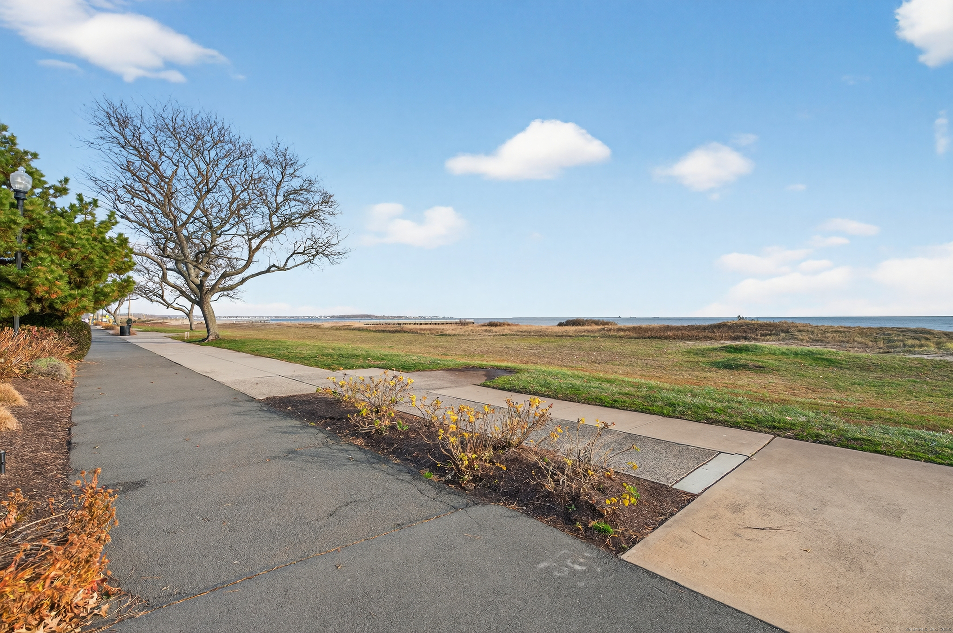 142 W Walk, Unit 142 West Haven, CT 06516 - Photo 21 of 22 a view of an ocean and beach