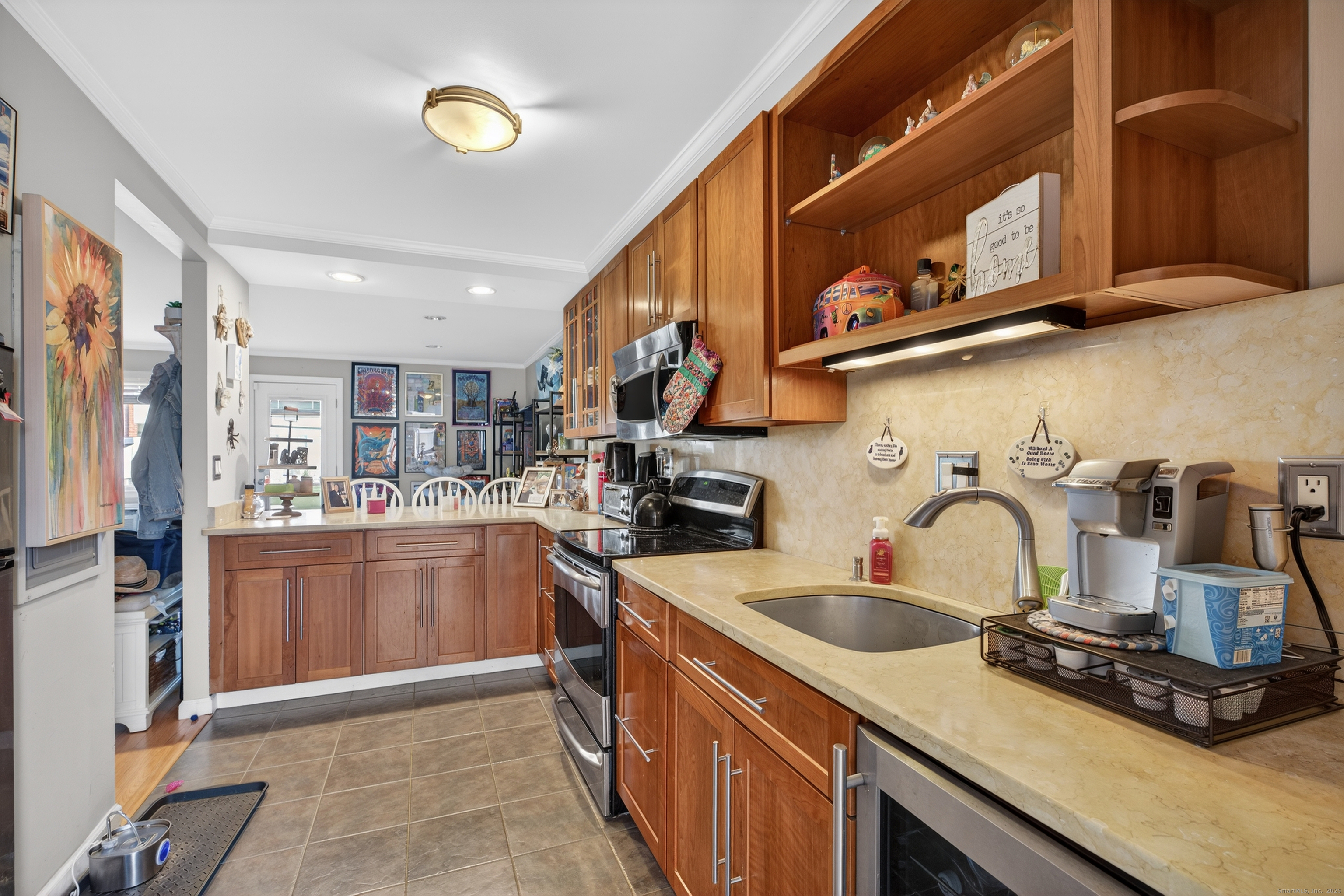 142 W Walk, Unit 142 West Haven, CT 06516 - Photo 4 of 22 a kitchen with stainless steel appliances granite countertop a sink stove and cabinets