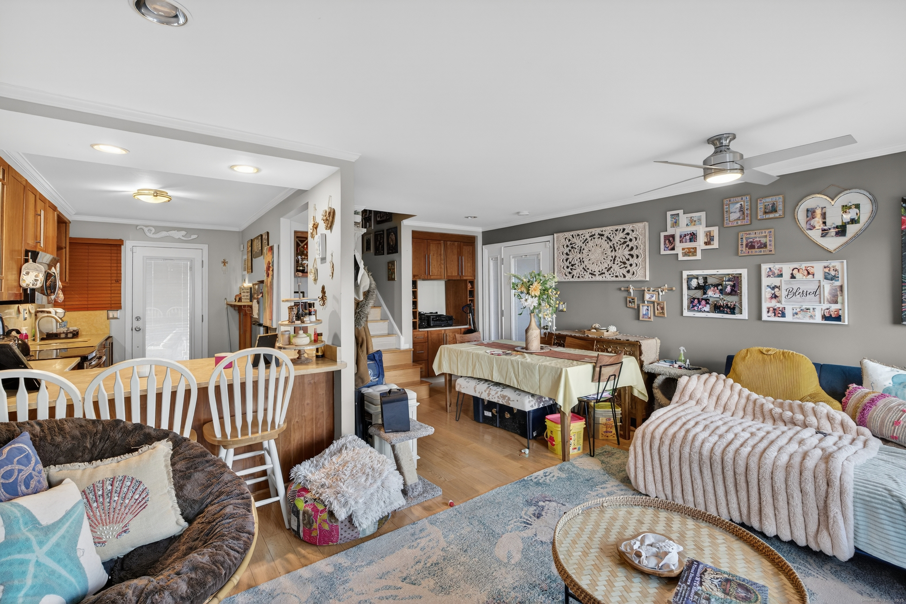 142 W Walk, Unit 142 West Haven, CT 06516 - Photo 8 of 22 a bedroom with furniture and a wooden floor