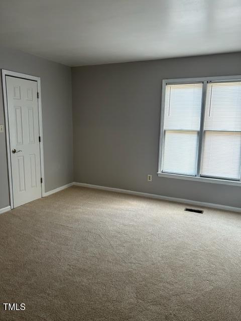 4604 Lavista Court, Unit A & B Raleigh, NC 27616 - Photo 11 of 33 an empty room with a window