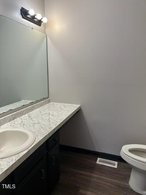 4604 Lavista Court, Unit A & B Raleigh, NC 27616 - Photo 12 of 33 a bathroom with a granite countertop sink and toilet