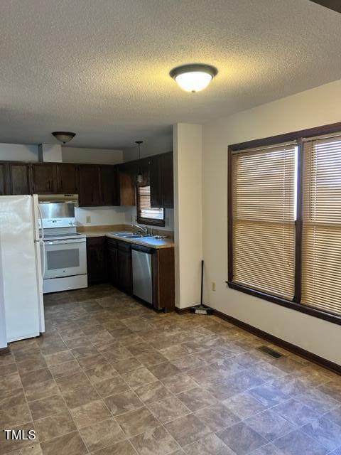 4604 Lavista Court, Unit A & B Raleigh, NC 27616 - Photo 18 of 33 a view of kitchen with stainless steel appliances granite countertop cabinets and window