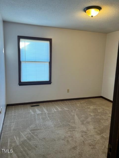 4604 Lavista Court, Unit A & B Raleigh, NC 27616 - Photo 25 of 33 an empty room with a window