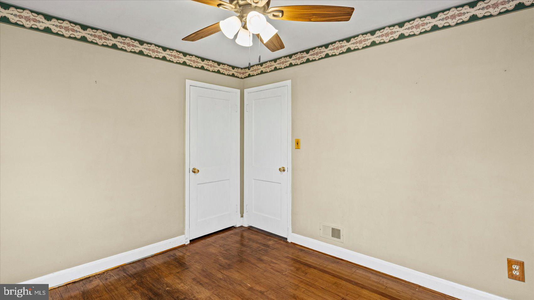 1821 Weyburn Road Baltimore, MD 21237 - Photo 16 of 45 a view of a room with wooden floor and fan