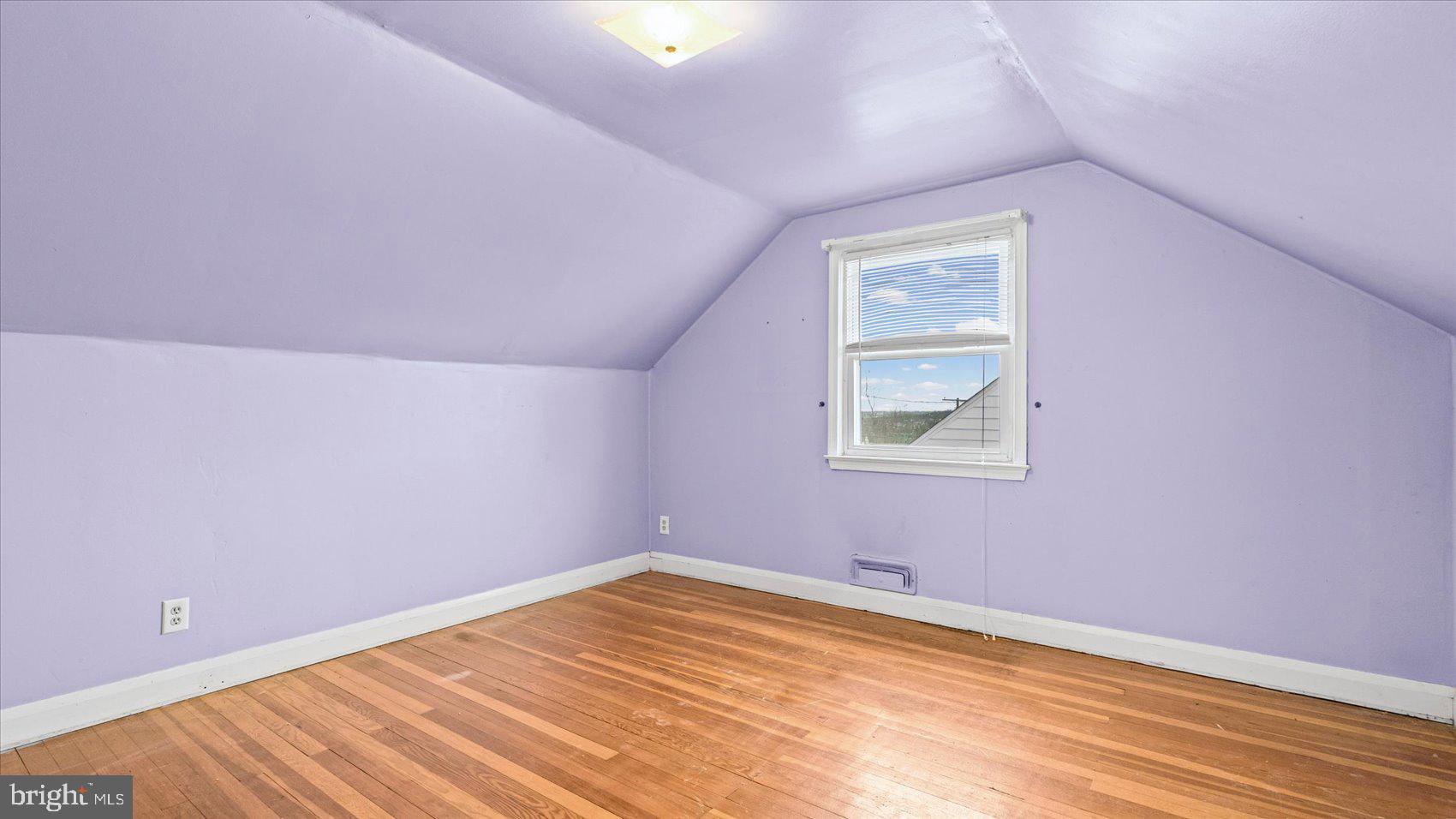 1821 Weyburn Road Baltimore, MD 21237 - Photo 22 of 45 a view of empty room with wooden floor and fan