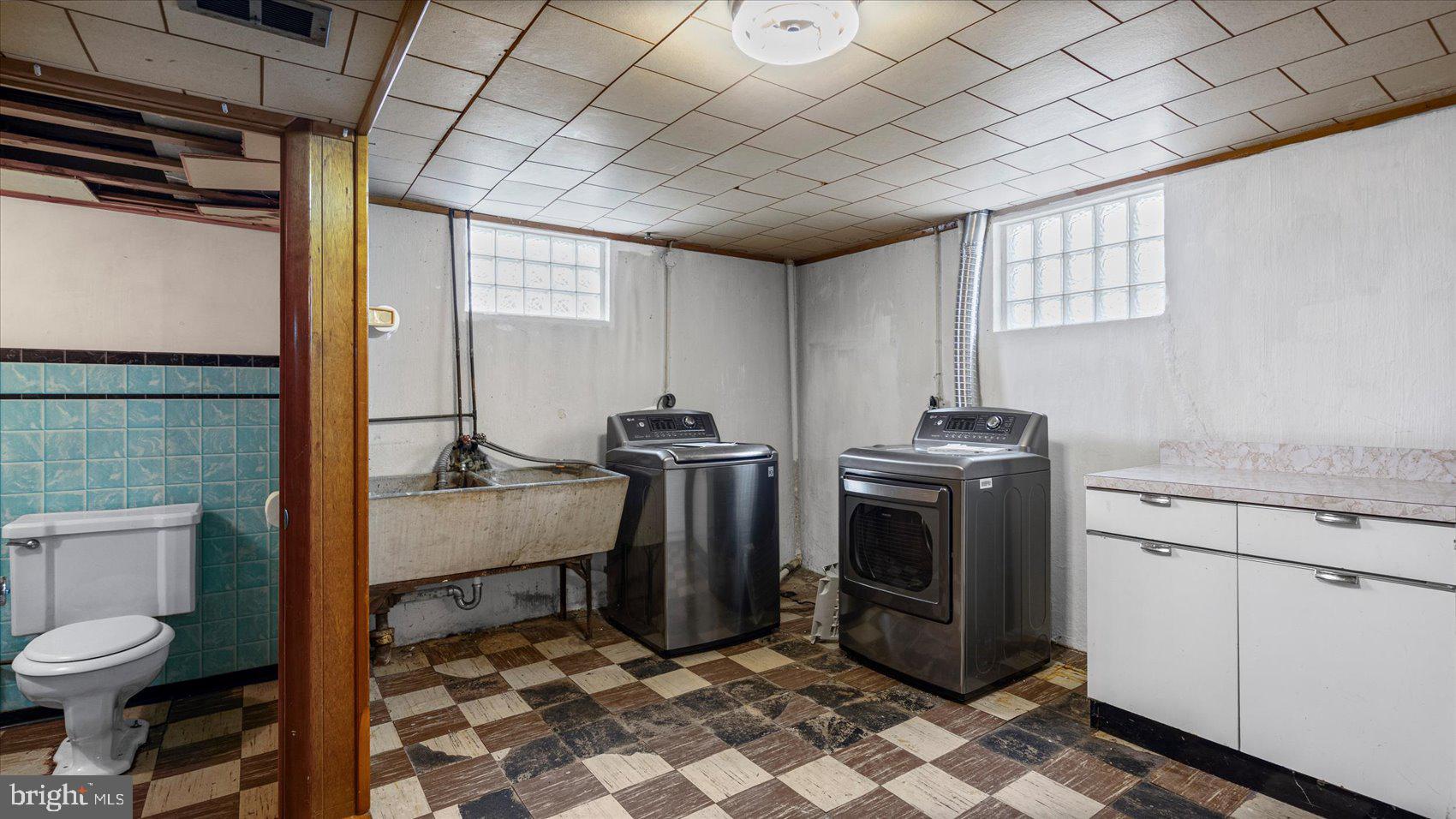 1821 Weyburn Road Baltimore, MD 21237 - Photo 28 of 45 a view of a bathroom with a sink toilet and a window