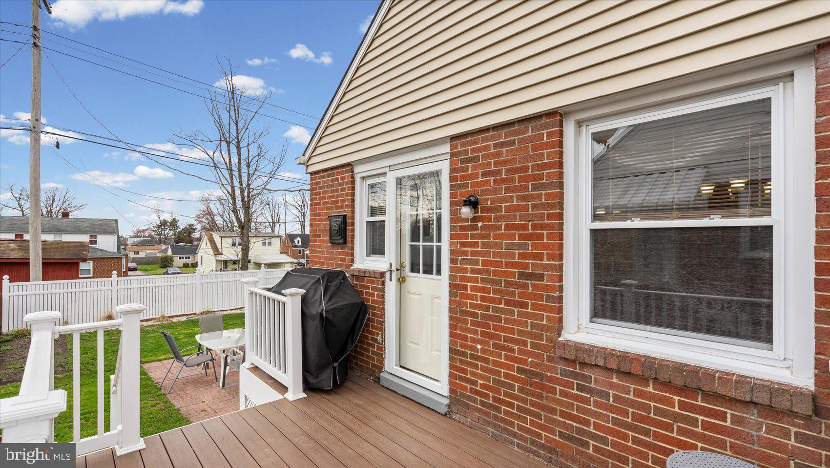 1821 Weyburn Road Baltimore, MD 21237 - Photo 31 of 45 a view of a house with a barbeque and wooden floor