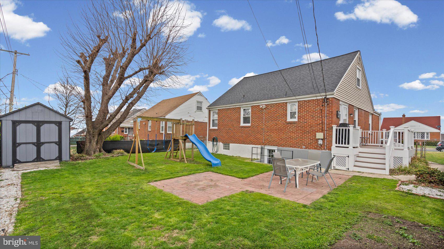 1821 Weyburn Road Baltimore, MD 21237 - Photo 32 of 45 a view of a house with a yard porch and sitting area