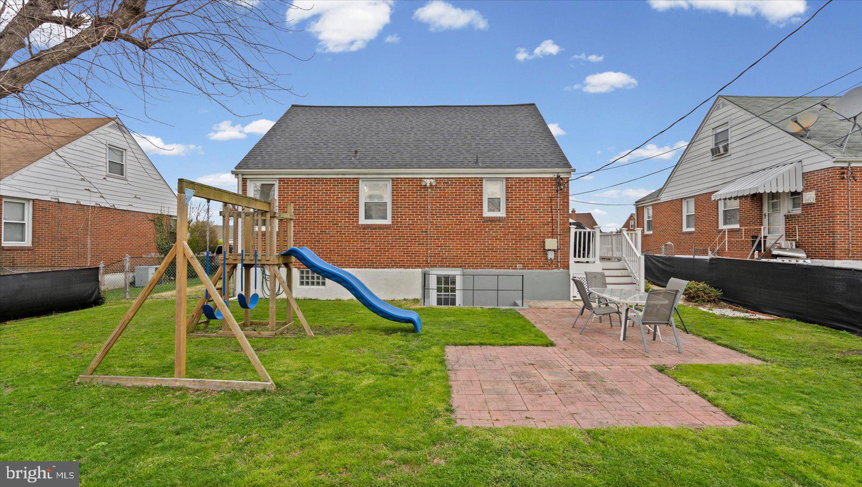 1821 Weyburn Road Baltimore, MD 21237 - Photo 33 of 45 a house that has a bunch of lawn chairs