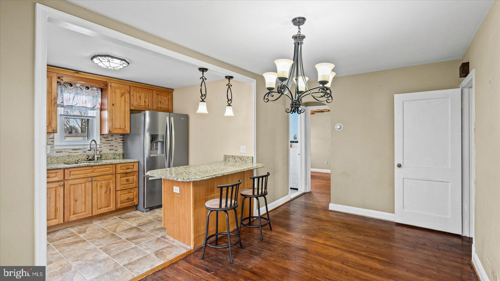1821 Weyburn Road Baltimore, MD 21237 - Photo 8 of 45 a view of a kitchen from the hallway