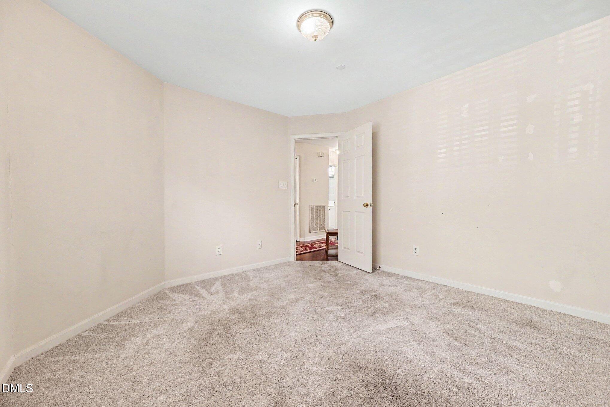 132 Springfork Drive Cary, NC 27513 - Photo 19 of 28 a view of an empty room
