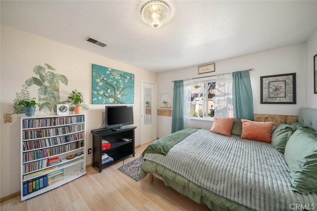 1480 Island Court Oceano, CA 93445 - Photo 13 of 31 a bedroom with furniture and a flat screen tv