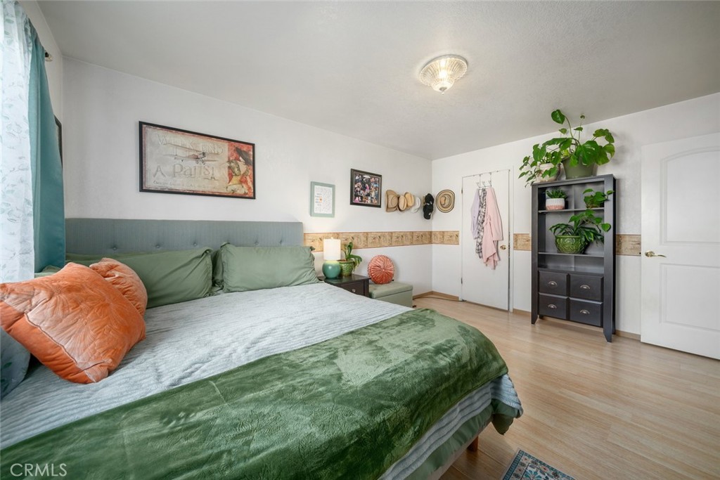 1480 Island Court Oceano, CA 93445 - Photo 14 of 31 a spacious bedroom with a bed and a couch