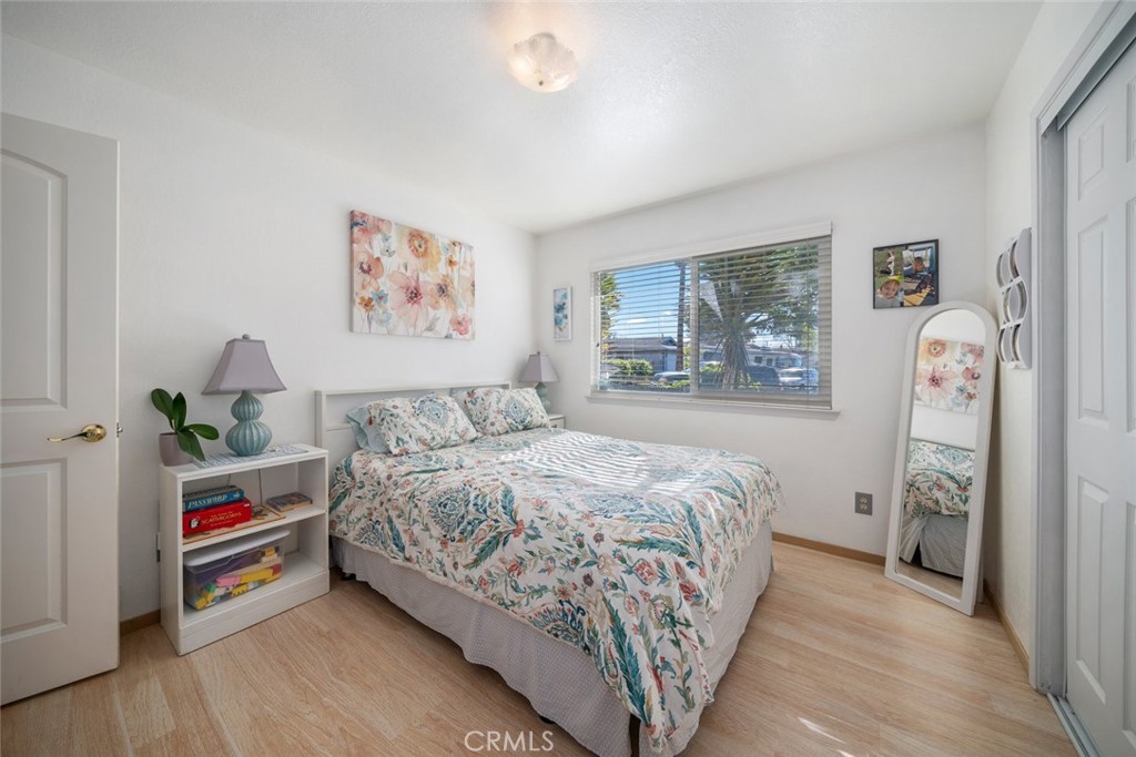 1480 Island Court Oceano, CA 93445 - Photo 18 of 31 a bedroom with bed and wooden floor