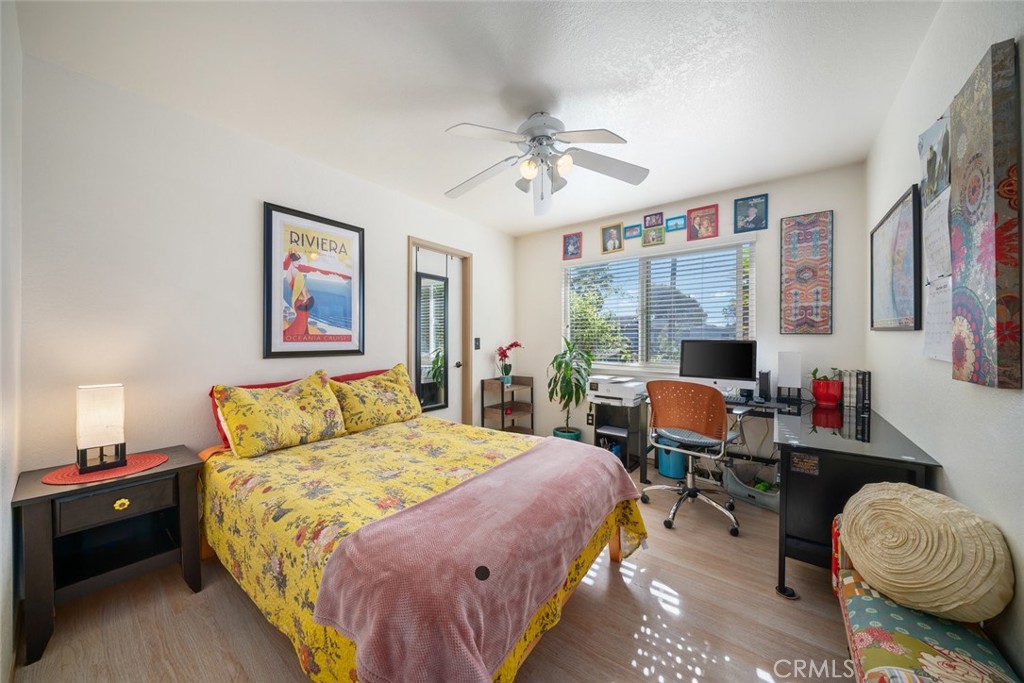 1480 Island Court Oceano, CA 93445 - Photo 21 of 31 a bedroom with a bed and a chandelier