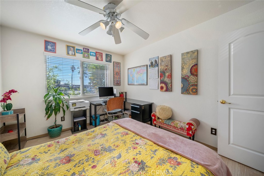 1480 Island Court Oceano, CA 93445 - Photo 22 of 31 a bedroom with a bed and a chandelier