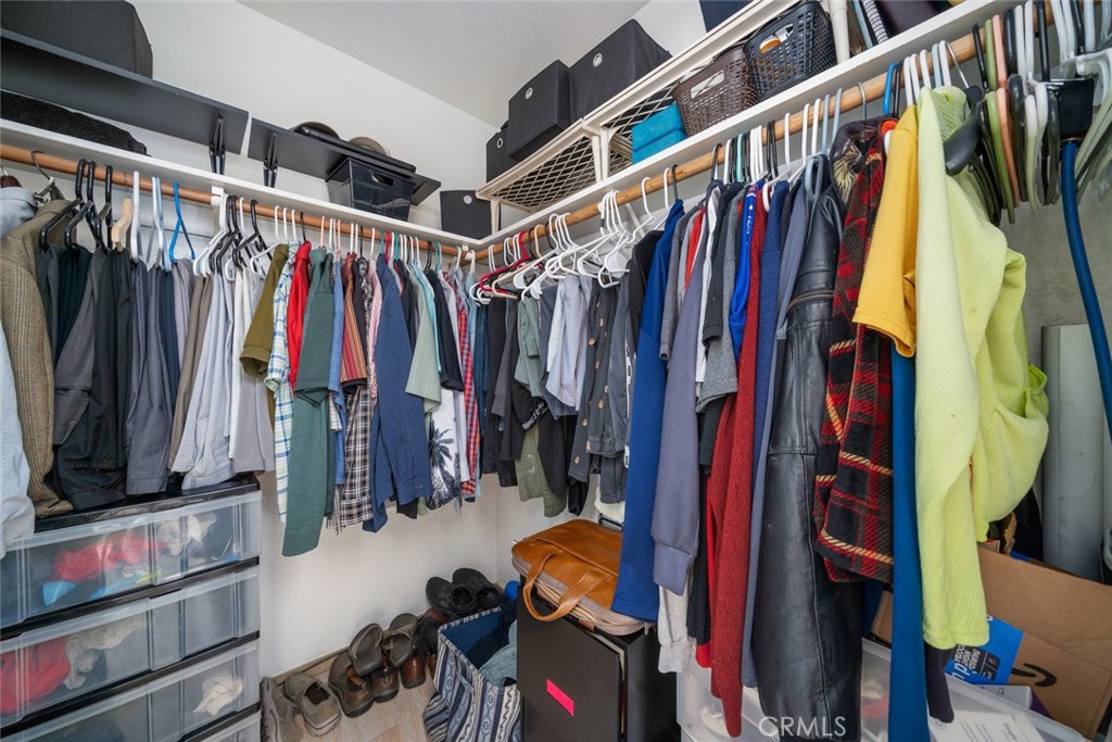 1480 Island Court Oceano, CA 93445 - Photo 24 of 31 a view of walk in closet with clothes and shoes