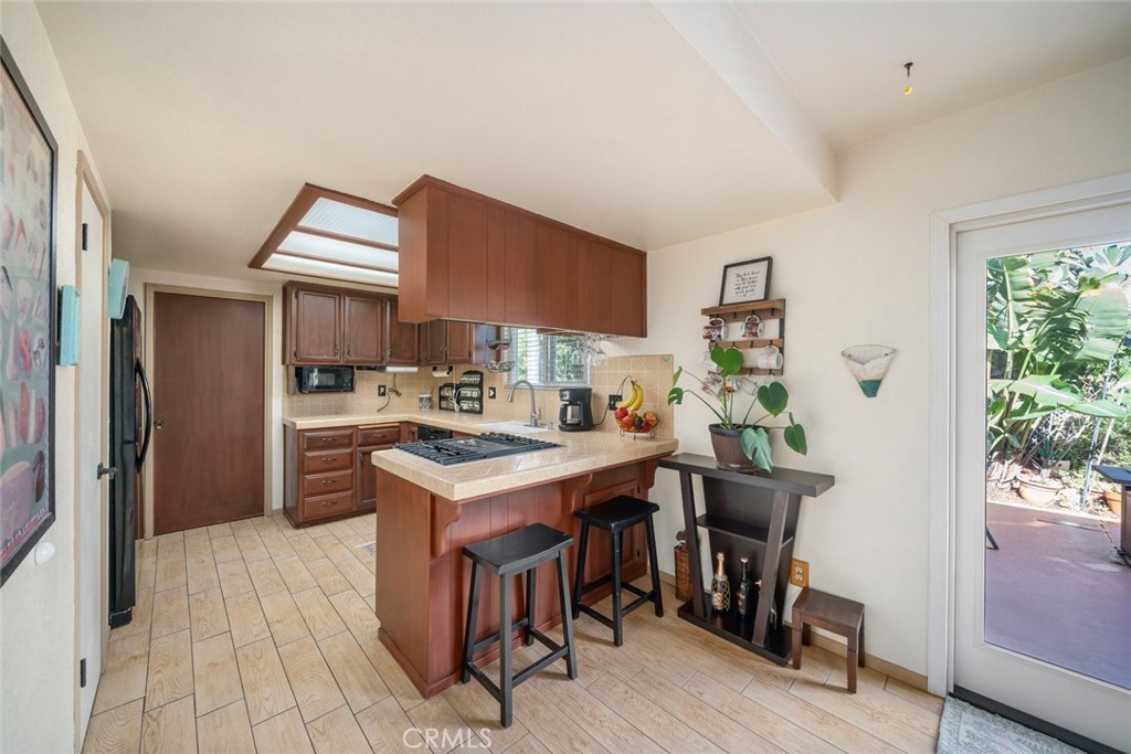1480 Island Court Oceano, CA 93445 - Photo 7 of 31 a kitchen with stainless steel appliances a sink stove and refrigerator