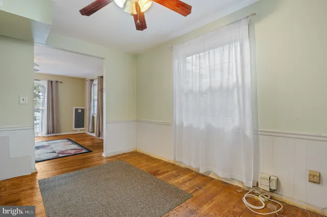 a bedroom with bed and a chandelier