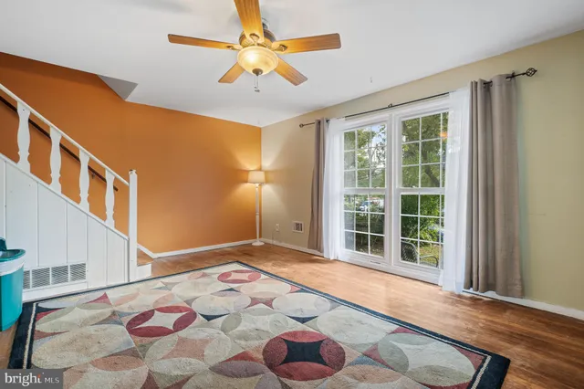 a bathroom with a toilet a sink and a mirror