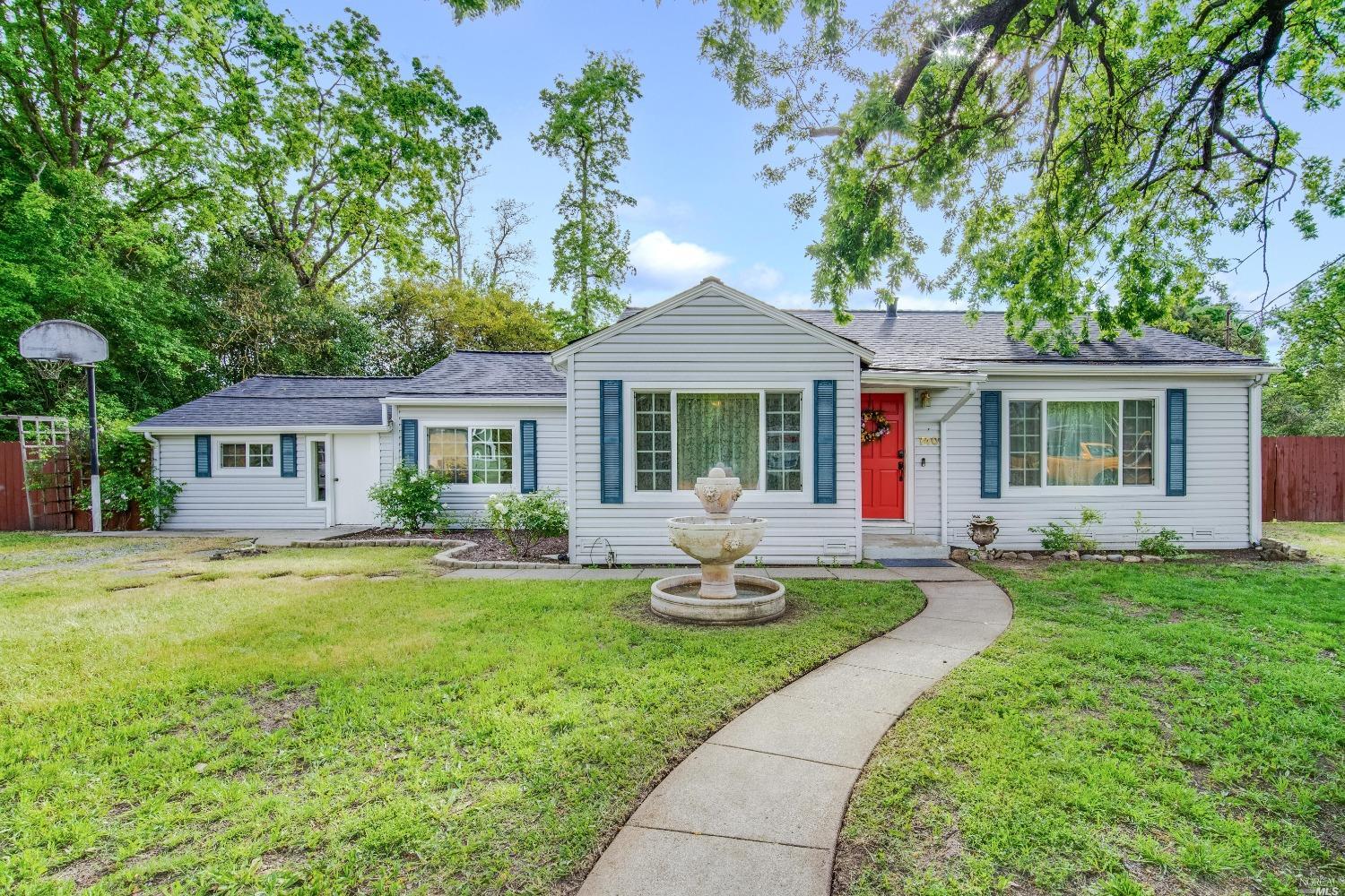 740 Blossom Way Santa Rosa, CA 95401 - Photo 1 of 1 a front view of a house with garden and porch