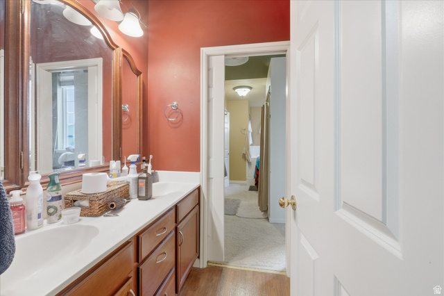 2887 View Crest Circle North Logan, UT 84341 - Photo 25 of 37 Bathroom featuring double vanity and light wood-style floors