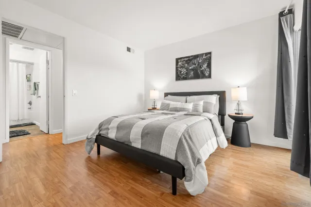 a bedroom with a bed and a table