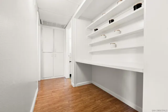 a view of an empty room with a closet