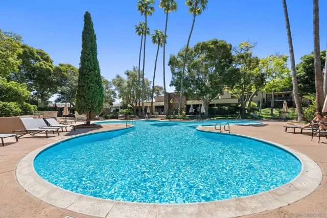 a view of a swimming pool with a patio