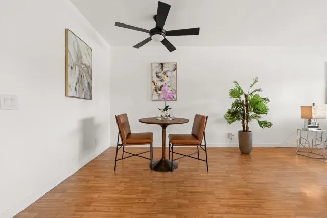 a view of a livingroom with furniture and a potted plant