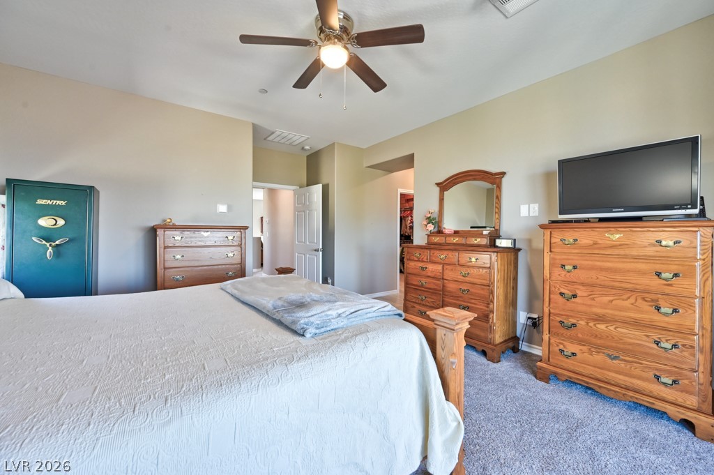 1054 Langston Ranch Avenue Henderson, NV 89002 - Photo 54 of 82 Carpeted bedroom with ceiling fan and baseboards