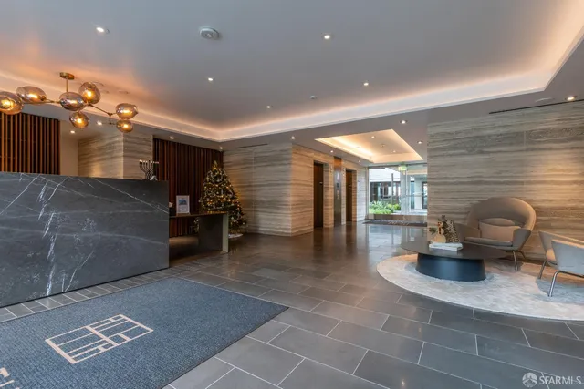 a lobby with furniture and stairs