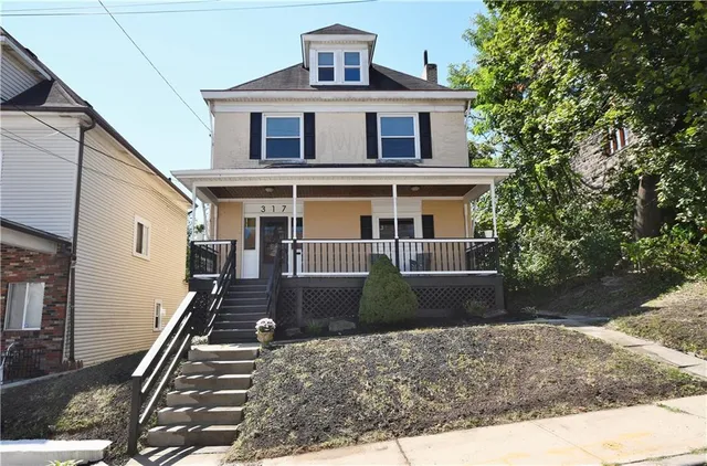 a front view of a house with street