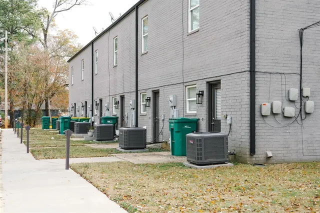 a view of a backyard with sitting area