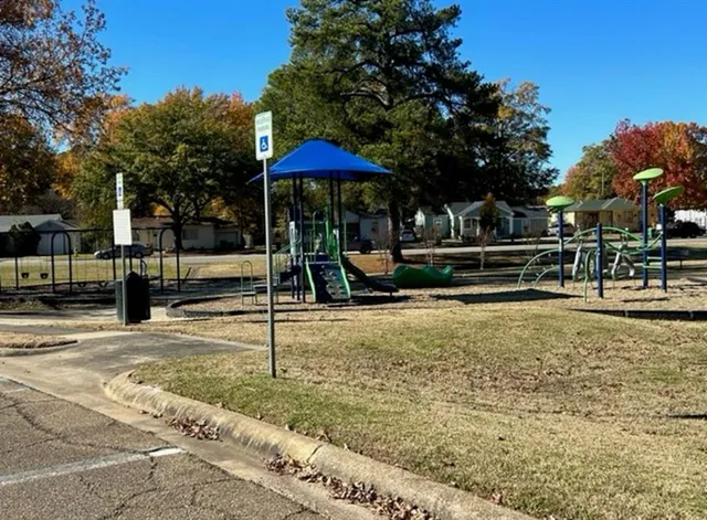 a view of a swimming pool with a bench