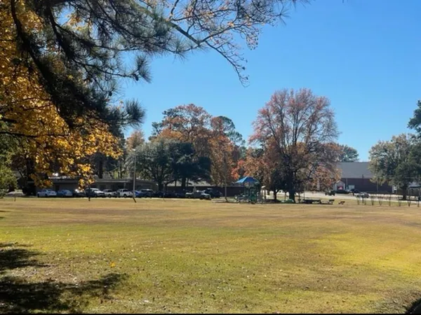 a view of a swimming pool and an outdoor space