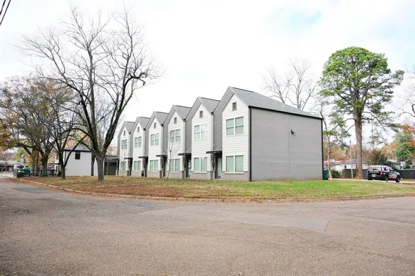 a view of a building with a yard